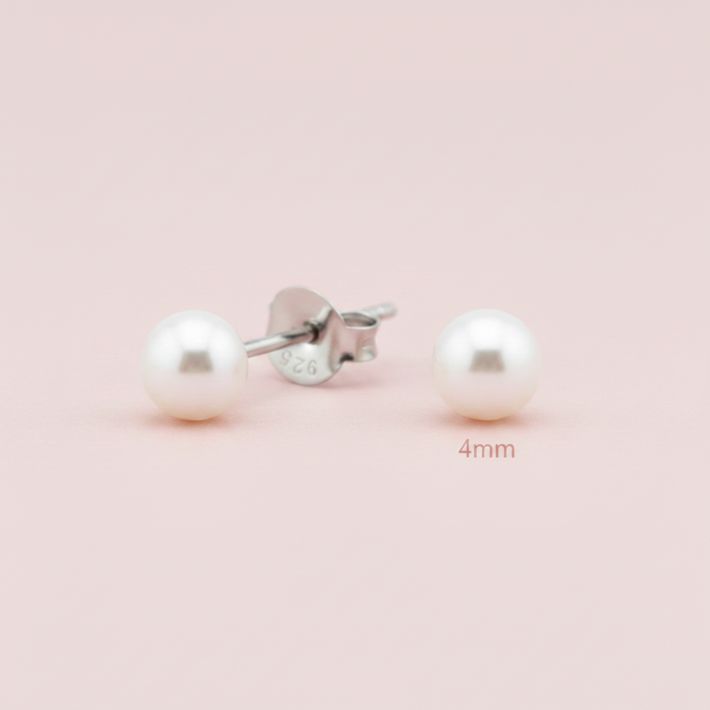 A pair of 4mm round white pearl stud earrings with silver posts, one shown from the front and the other from the side/back. The silver post is stamped with '925' and '926' sterling silver markings.