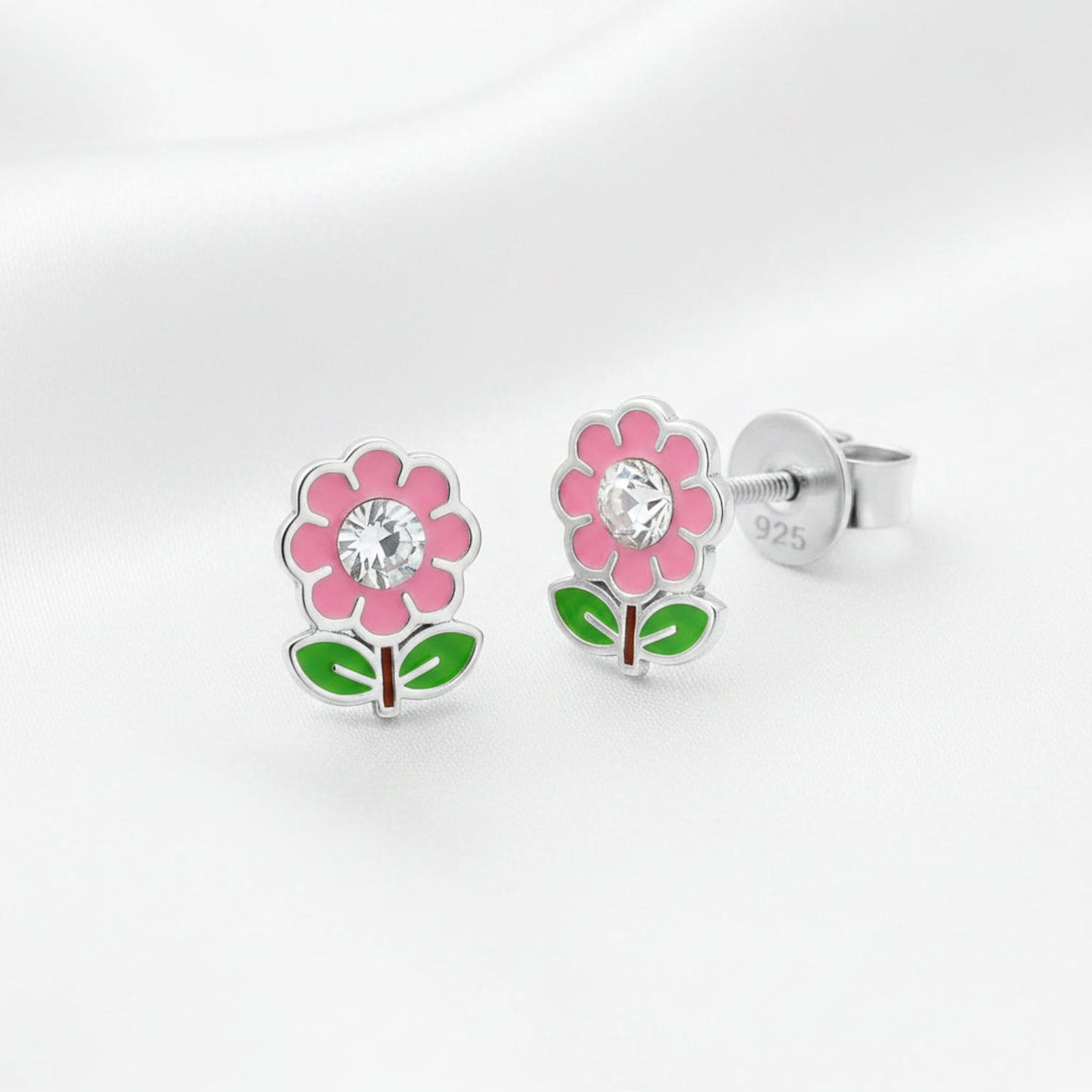 Flower-shaped earrings with pink flowers and green leaves on a white background, rhodium-plated.