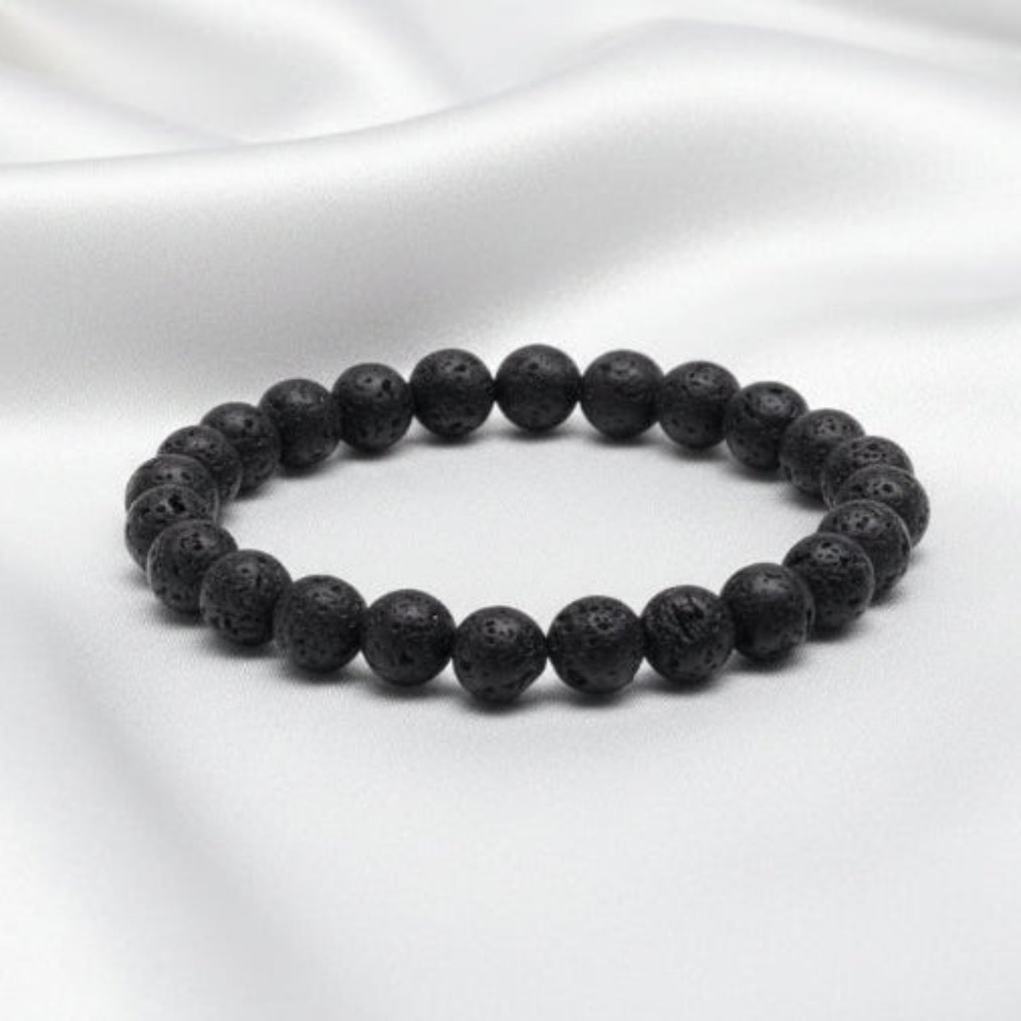 Black beaded bracelet on a white background
