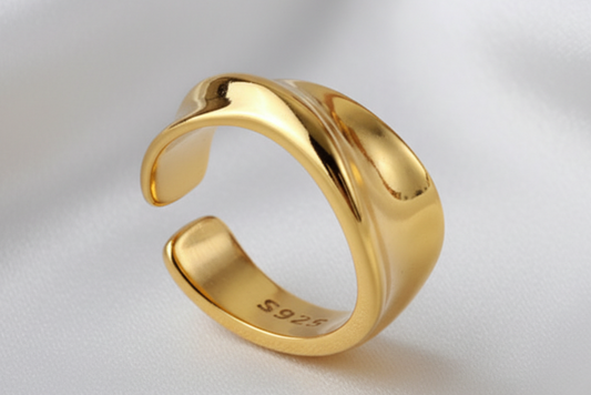 Gold ring with '925' stamp on a white background