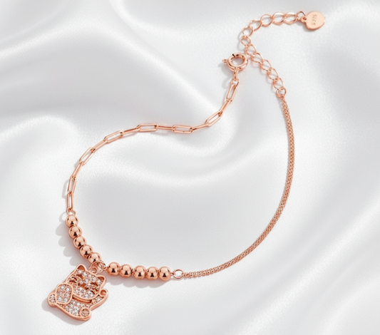 Rose Gold Cat Charm Bracelet on White Silk