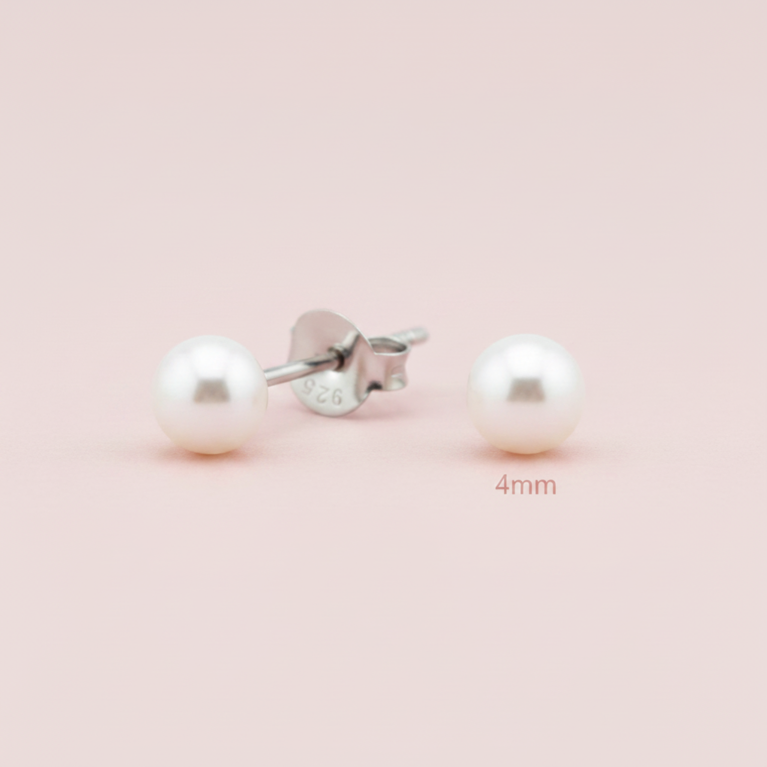A pair of 4mm round white pearl stud earrings with silver posts, one shown from the front and the other from the side/back. The silver post is stamped with '925' and '926' sterling silver markings.