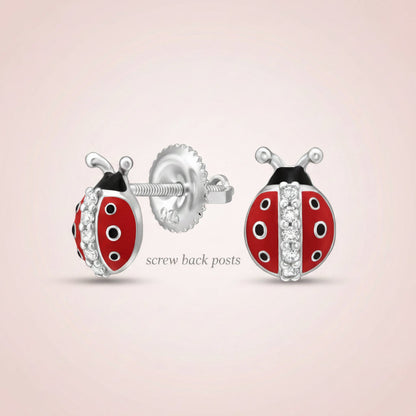 Ladybug-shaped earrings with rhodium plating on a white background