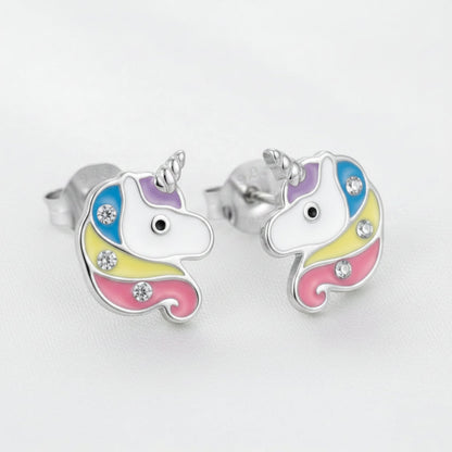 A pair of rhodium-plated unicorn stud earrings with colorful enamel detailing and small crystal accents, shown on a white background.
