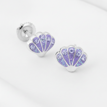 Silver-plated shell-shaped stud earrings with a lavender purple floral pattern and rhinestones, shown on a white textured background with a 'Rhodium PLATED' text overlay and a circular inset demonstrating the rhinestone setting.