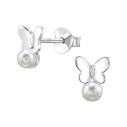Butterfly-shaped earrings with pearl centers on a white background