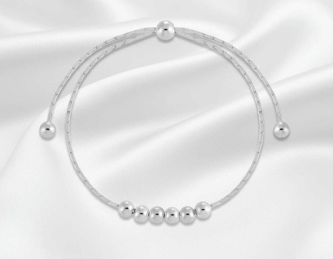 Silver beaded bracelet on a white background