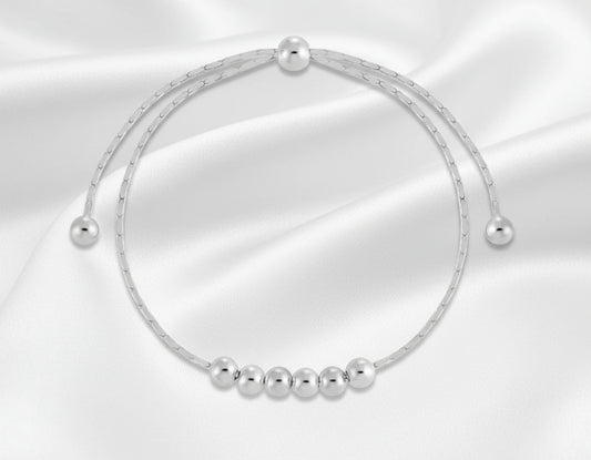 Silver beaded bracelet on a white background