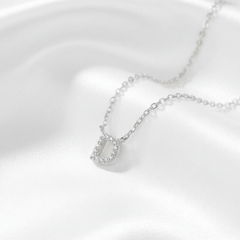 Silver necklace with a pendant on a white background