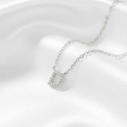 Silver necklace with a pendant on a white background