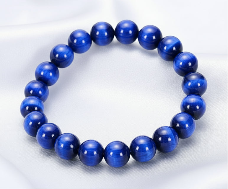 Blue beaded bracelet on a white background