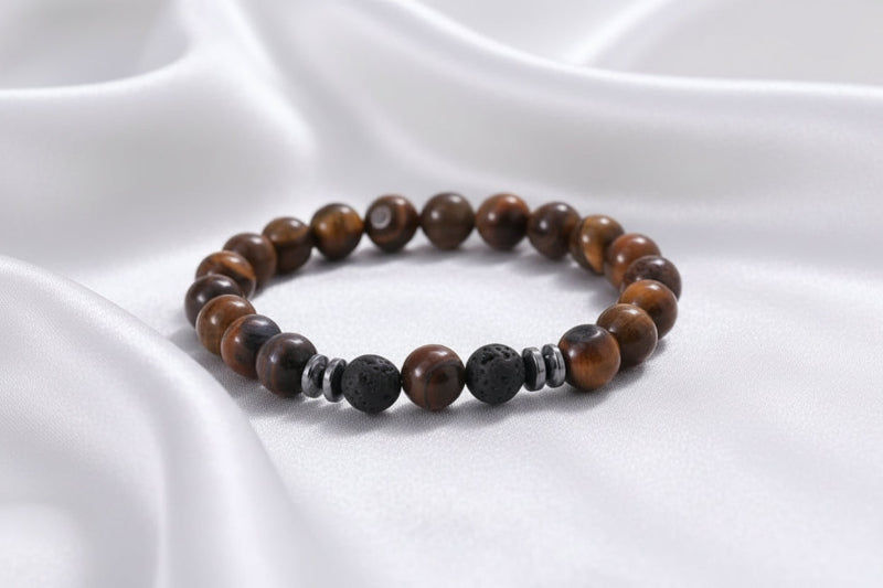 Beaded bracelet with brown and black stones on a white surface
