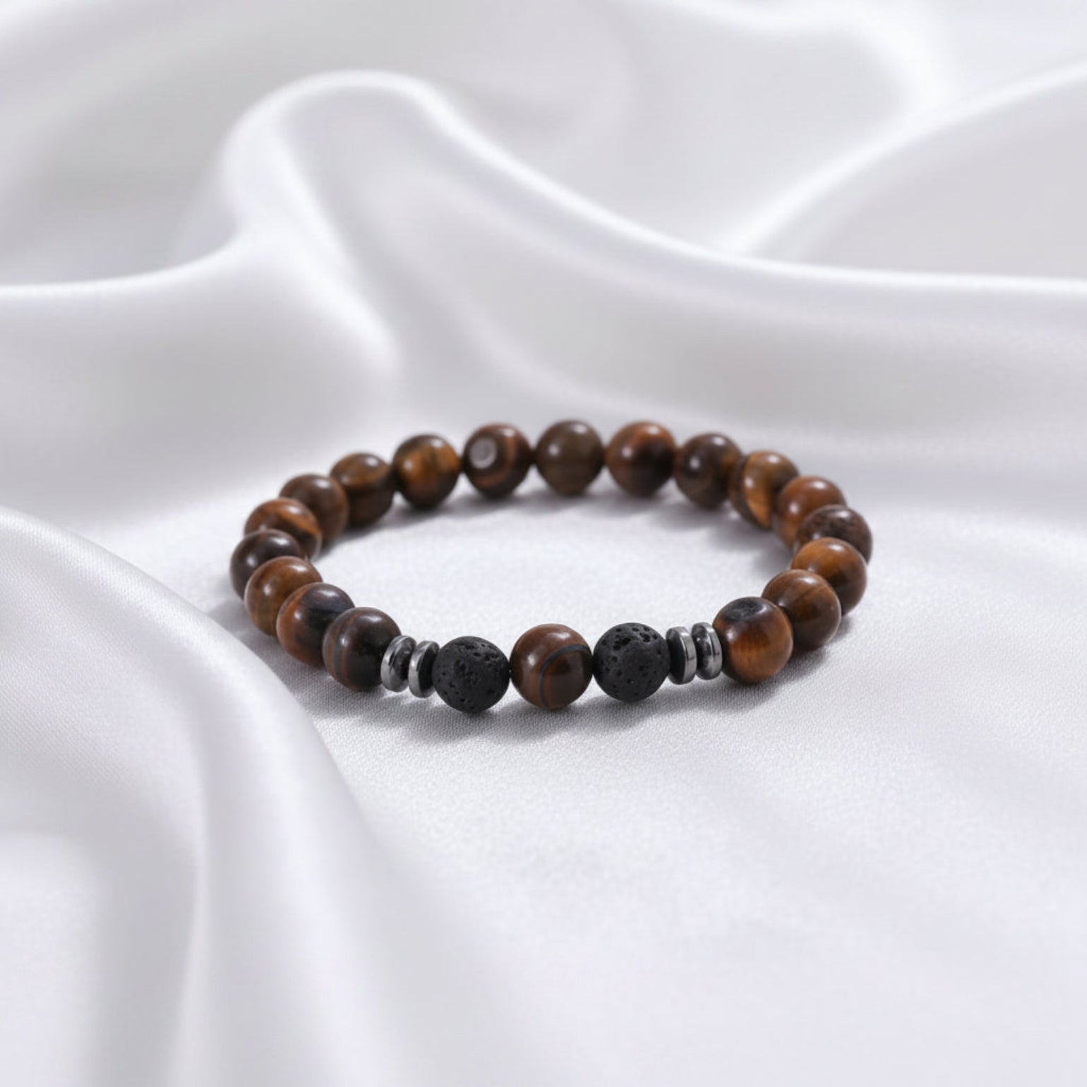 Beaded bracelet with brown and black stones on a white surface