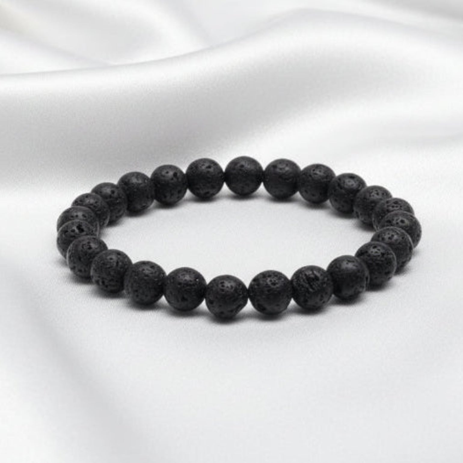 Black beaded bracelet on a white background