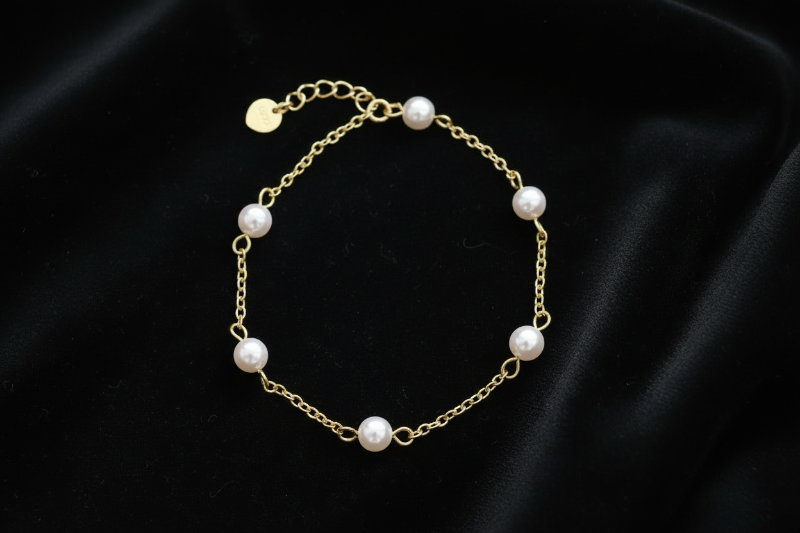 Pearl bracelet on a black background
