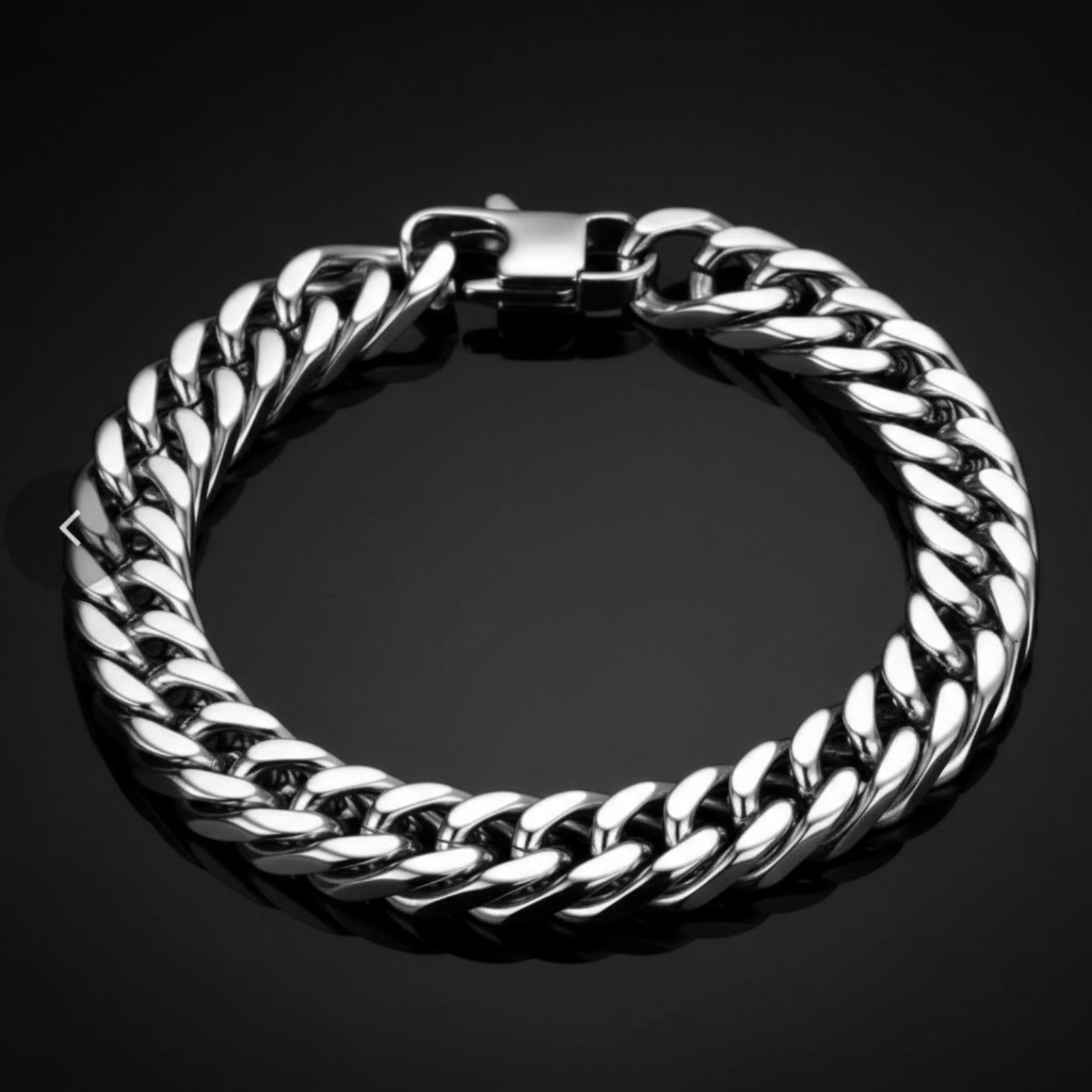 A thick silver-tone Cuban link chain bracelet with a polished clasp, displayed on a dark reflective surface.
