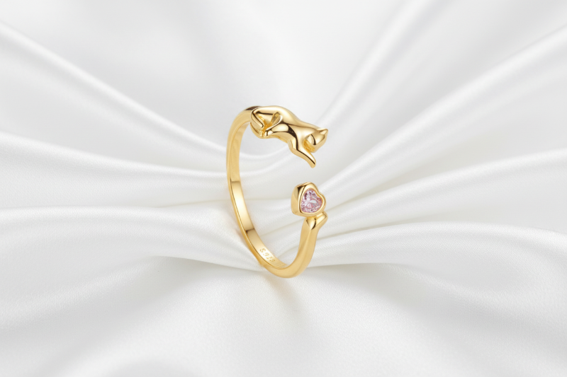 Two rings, one gold and one silver, on a light blue background