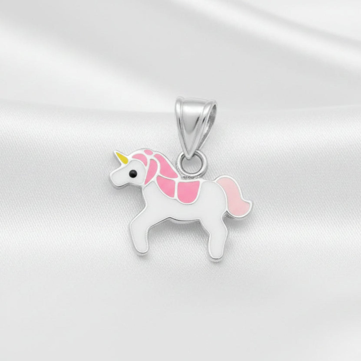Unicorn-shaped pendant with pink accents on a white background