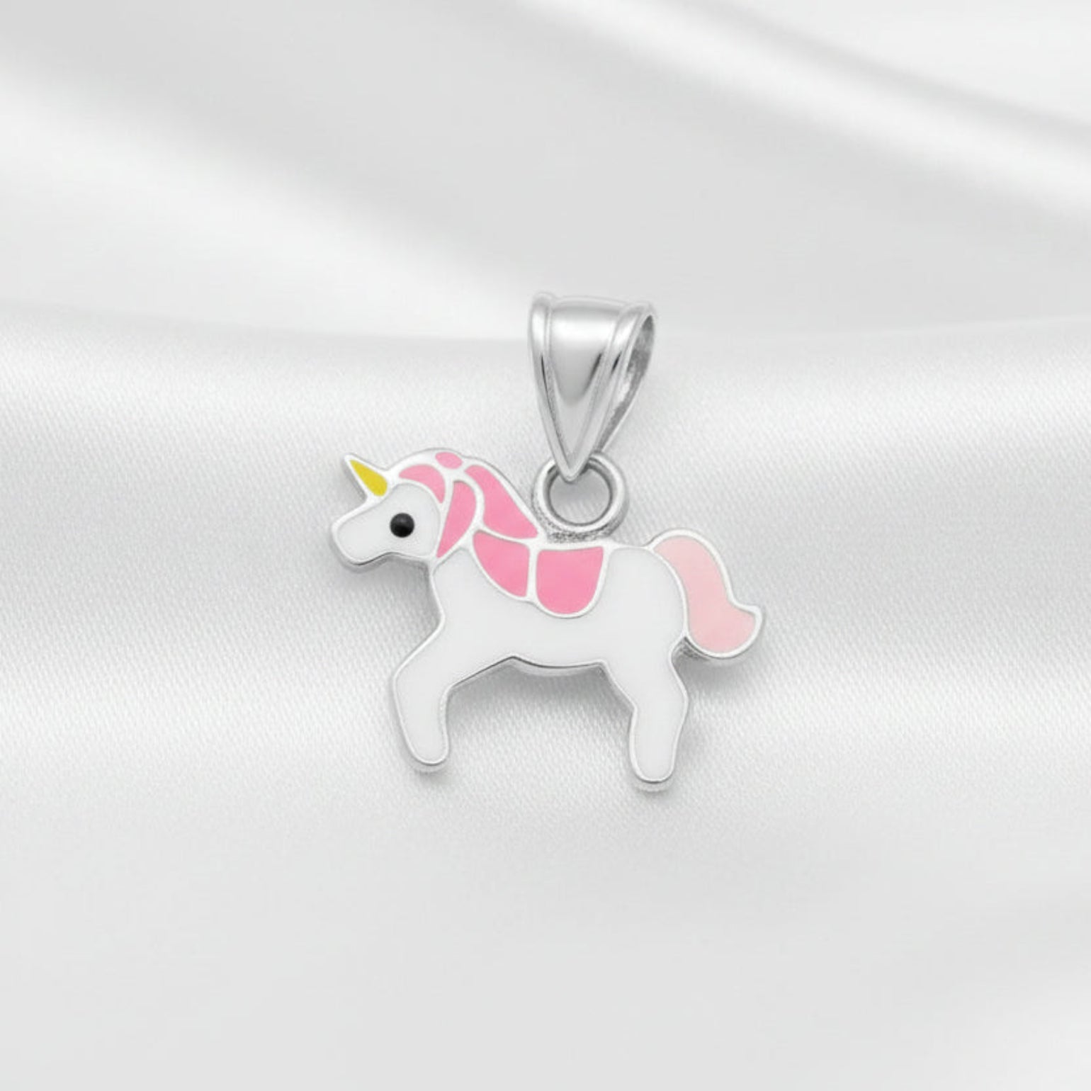 Unicorn-shaped pendant with pink accents on a white background