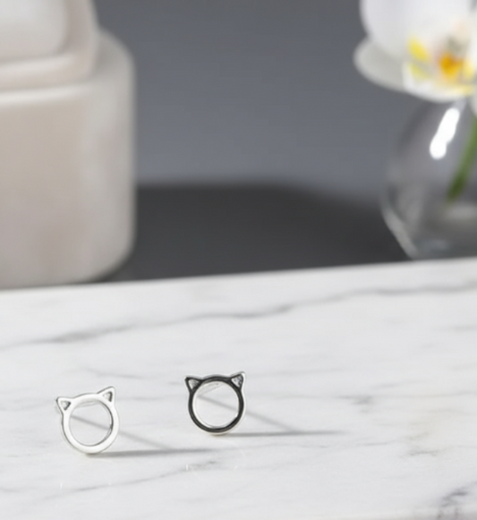 Cat Ear Stud Earrings on Marble Display