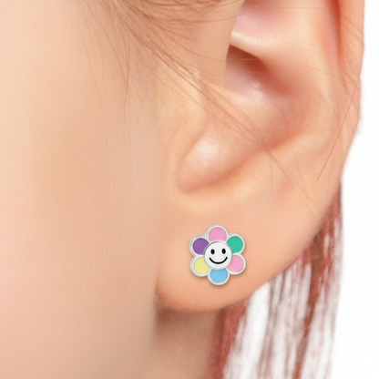 Child's ear with flower smiley studs