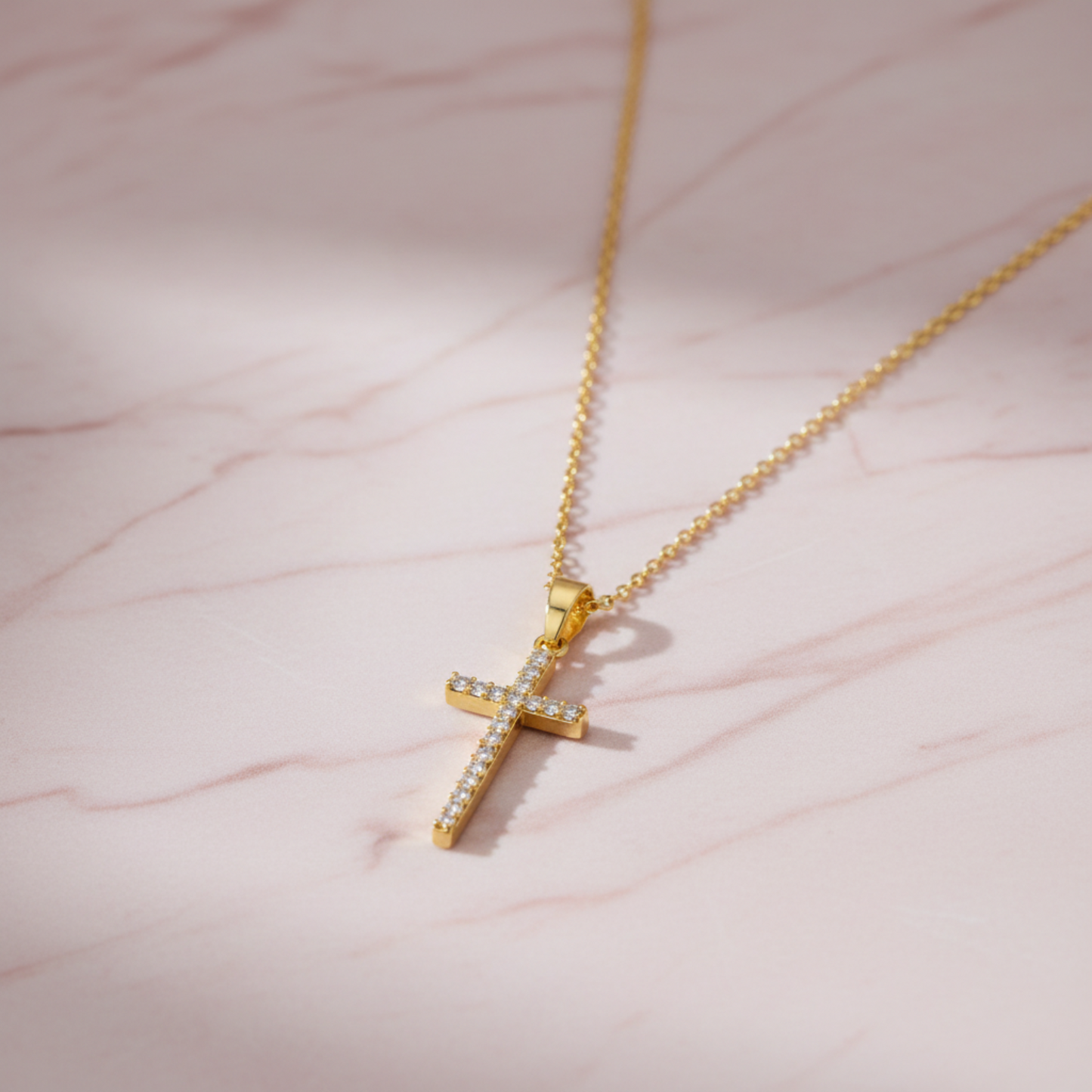 Cross pendant on pink marble