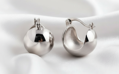 Enhanced Silver Dome Hoops on White Fabric
