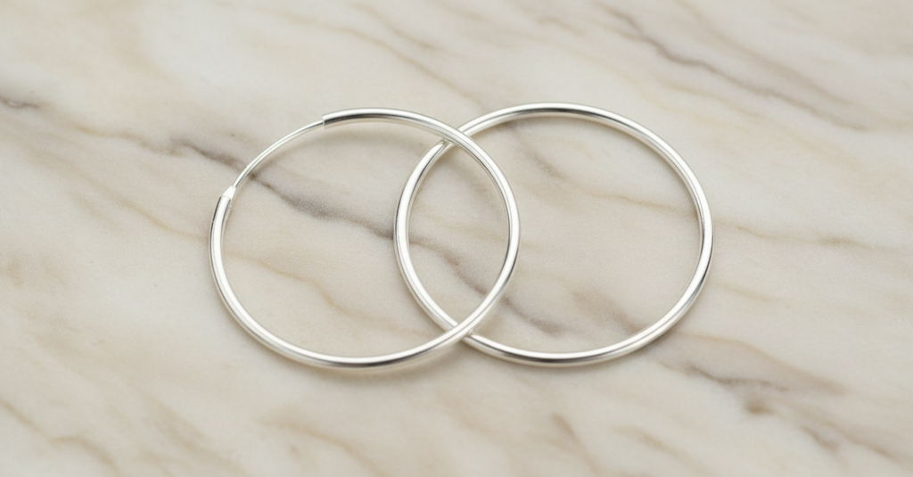 Hoop Earrings on Marble Surface