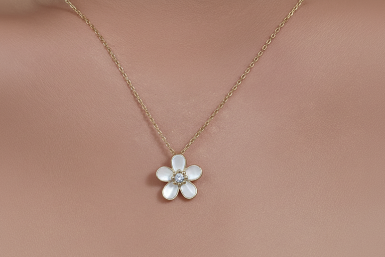 Flower-shaped pendant necklace on human skin
