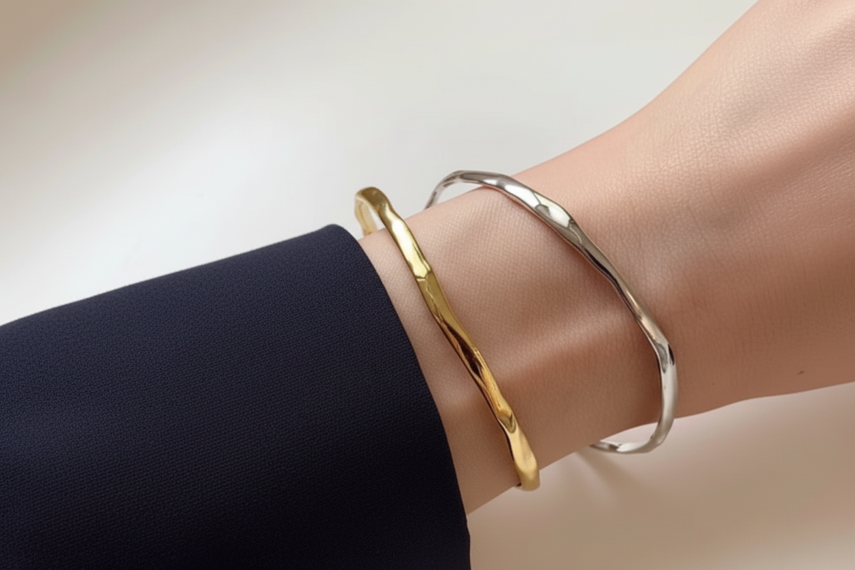 925 sterling silver irregular wave hammered open cuff bracelet in gold and silver worn on wrist