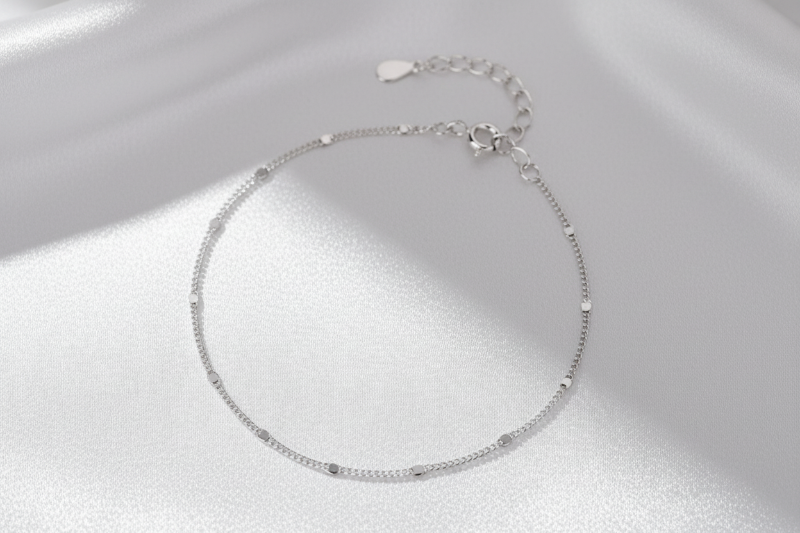 Silver station sequin bracelet on a white background