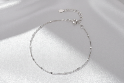 Silver station sequin bracelet on a white background