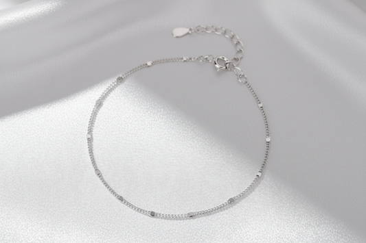 Silver station sequin bracelet on a white background