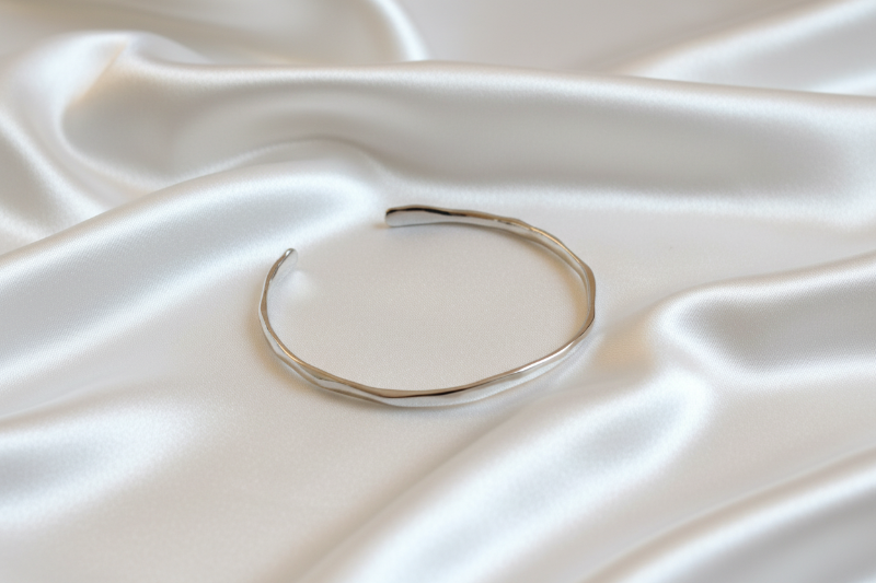 Gold bracelet on a white background