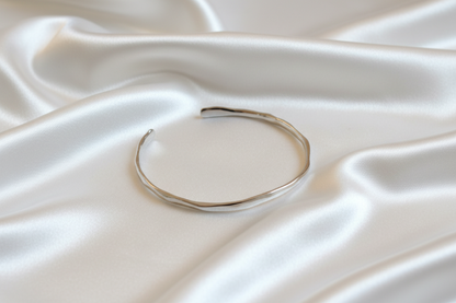 Gold bracelet on a white background