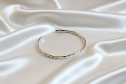 Gold bracelet on a white background