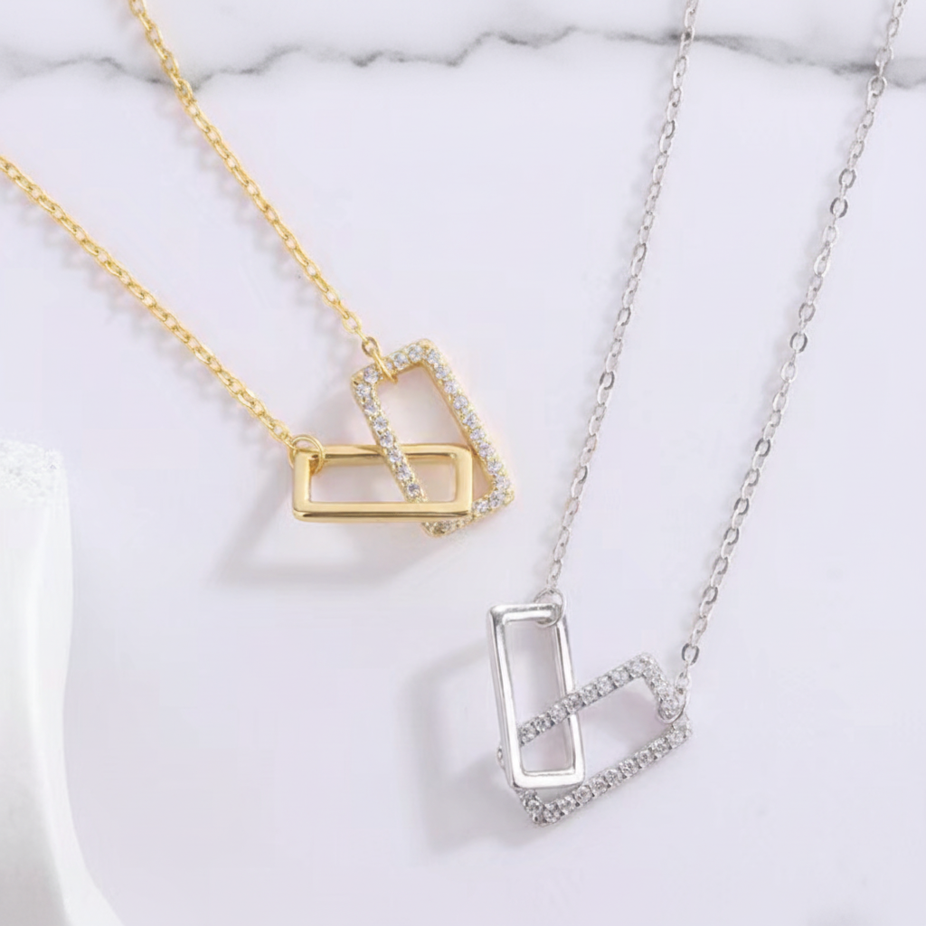 Geometric pendant on marble surface