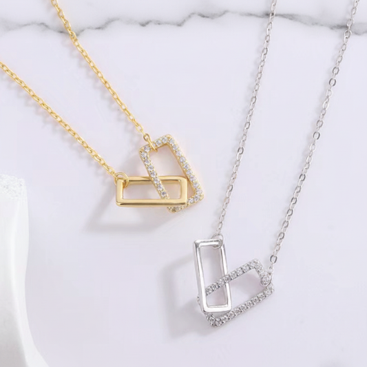 Geometric pendant on marble surface