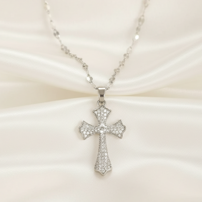 Silver cross necklace on a white background 