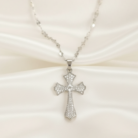 Silver cross necklace on a white background 