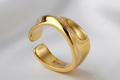 Gold ring with '925' stamp on a white background