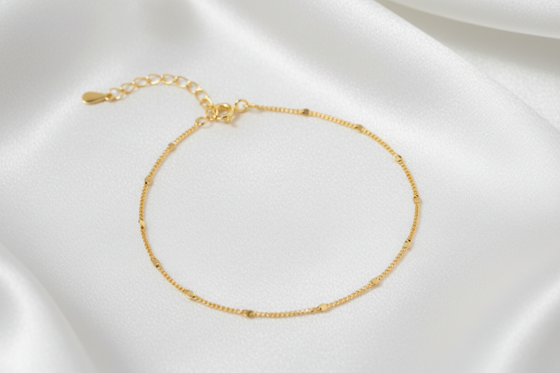 Gold bracelet on a white background