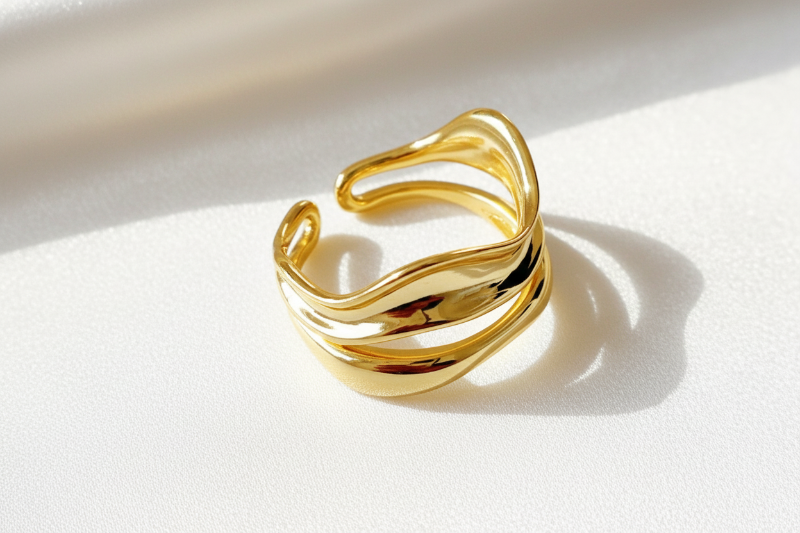 Gold ring on a light background
