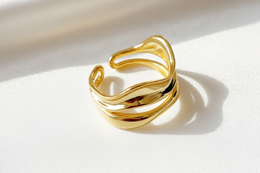 Gold ring on a light background