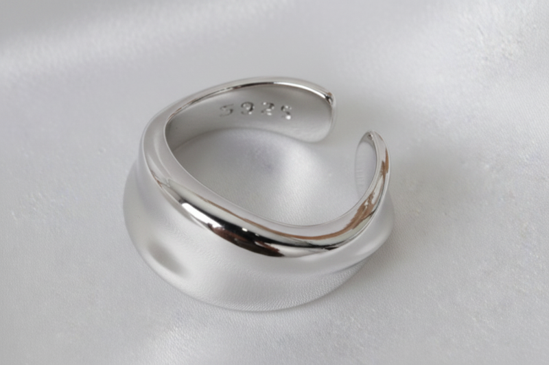 Silver ear cuff on a white background