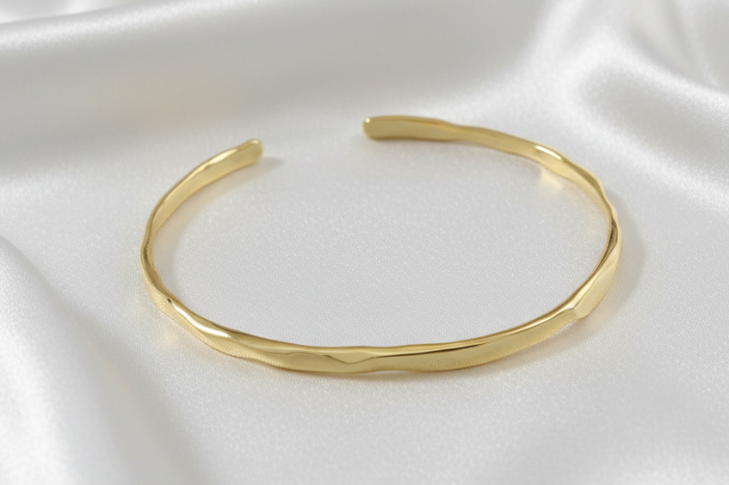 Gold bracelet on a white background