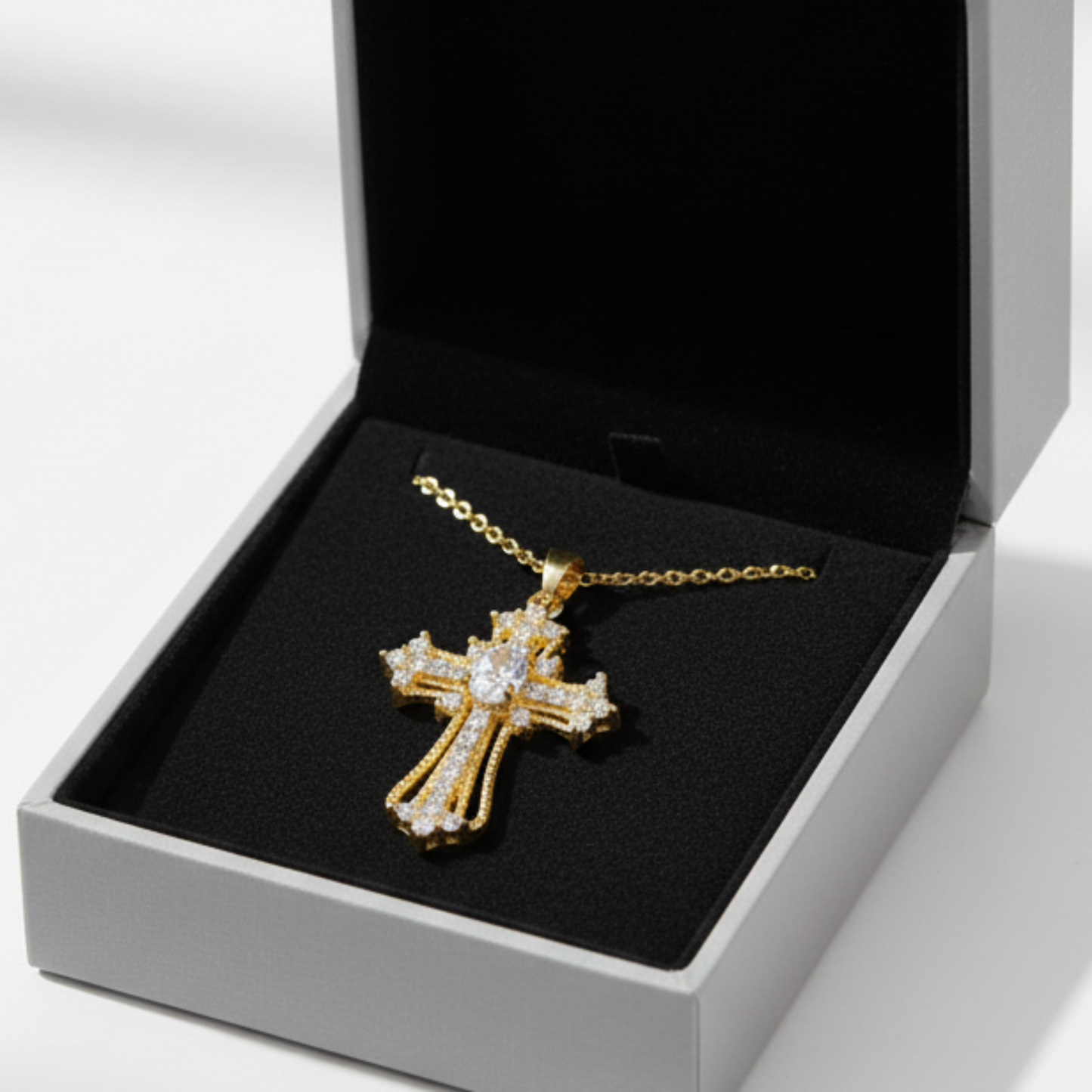 Ornate cross pendant in grey drawer box