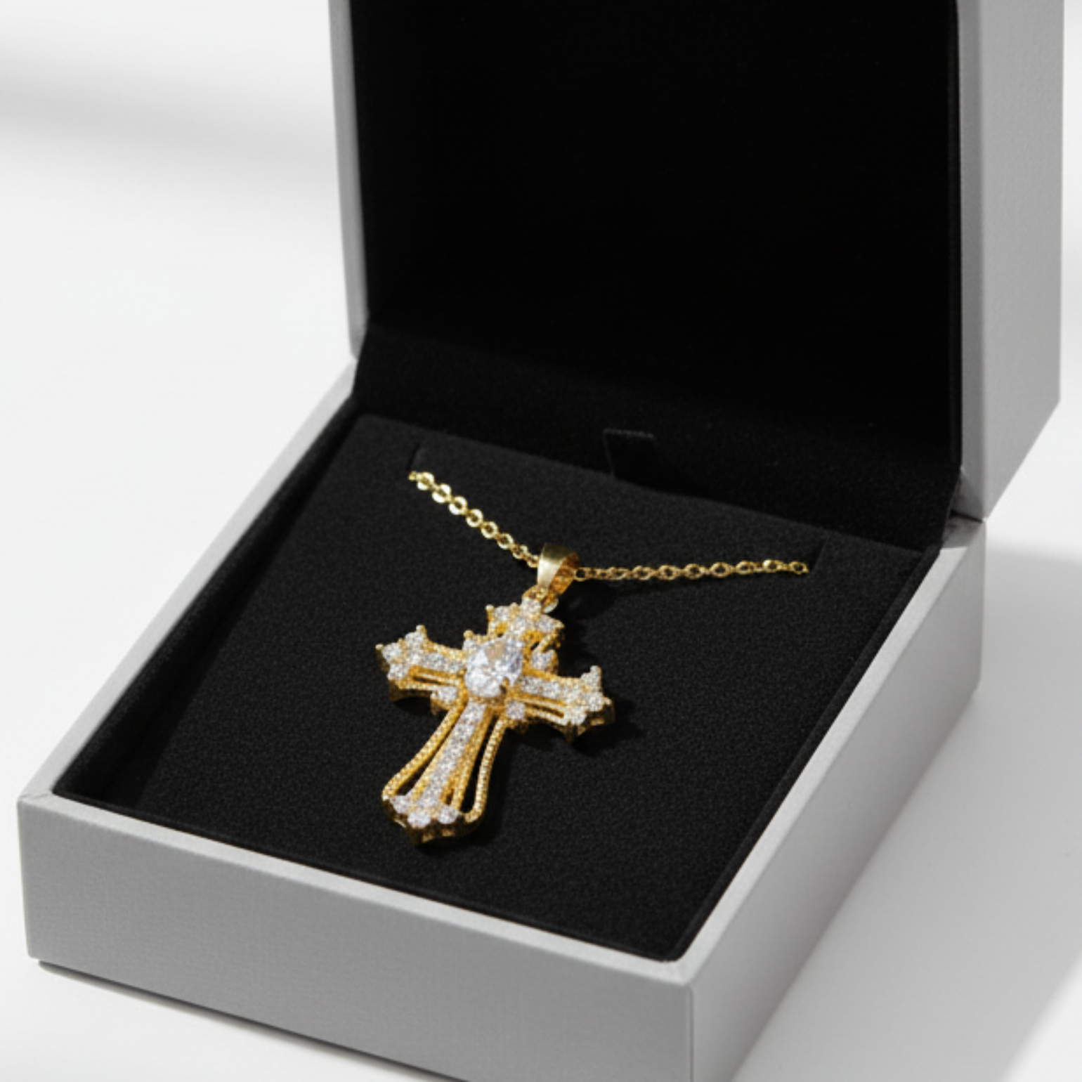 Ornate cross pendant in grey drawer box