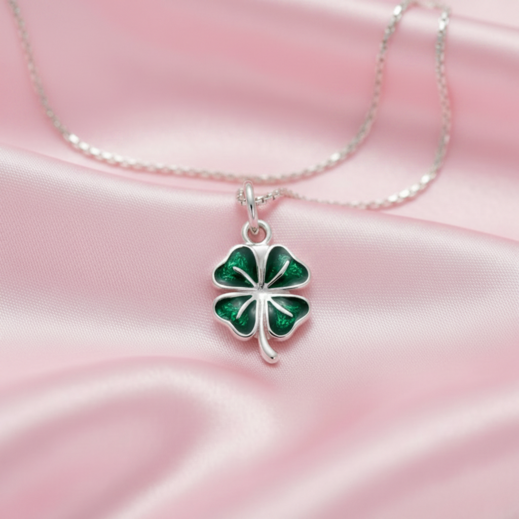 Pink satin flat lay silver 4-leaf clover pendant with green epoxy on silver chain