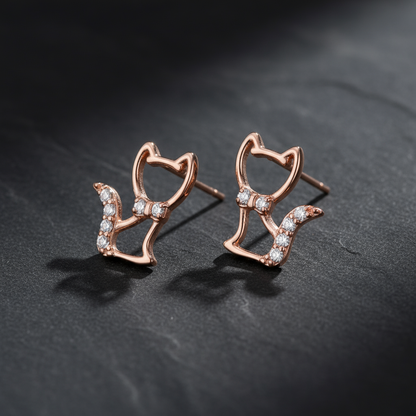 Rose Gold Cat Earrings on Dark Background at Angle